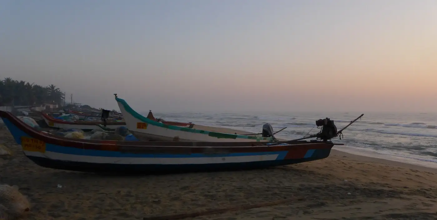Fishing boats on Indian beach at sunset